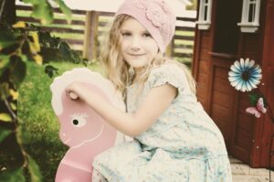 child, girl, model, caucasian, blonde, little girl, girl model, child model, blonde model, caucasian girl, blonde girl, dress, bonnet, playing, rocking horse, young girl, smile, smiling, portrait, child, girl, girl, girl, girl, little girl, little girl, little girl, little girl, little girl, rocking horse, young girl